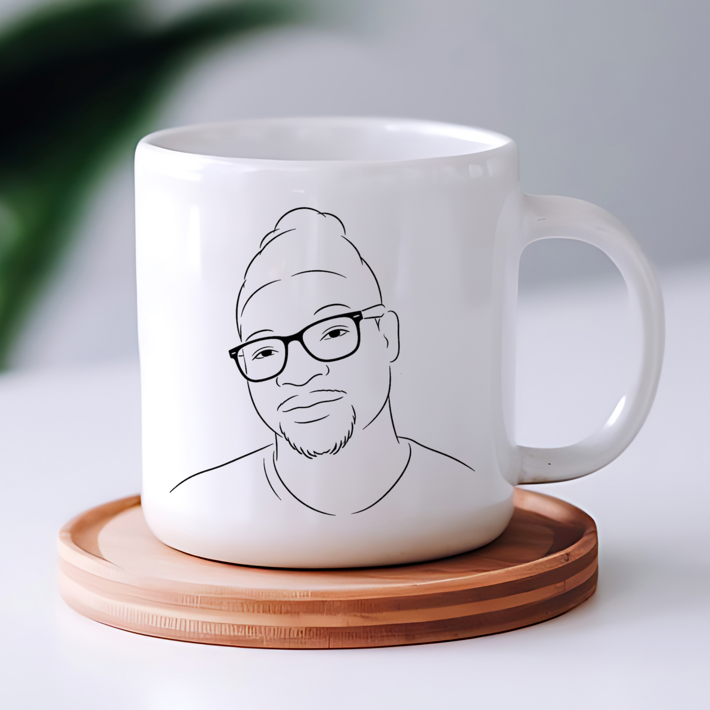 Portrait redessiné au trait d'encre noire, imprimé sur un mug en céramique blanche